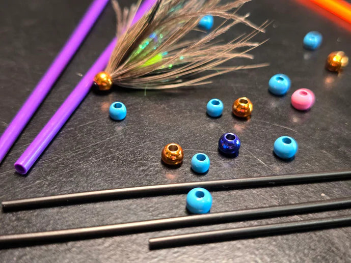 Aqua Flies Tube Beads – precision-molded fly tying beads in multiple sizes and finishes, used to add weight and flare to tube flies and intruders.