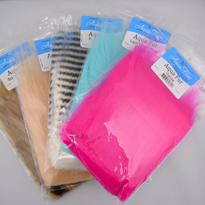 Various colors of Aqua Fur by Aqua Flies arranged in individual bundles—an ultra-fine, translucent synthetic dubbing perfect for steelhead, salmon, and streamer patterns.