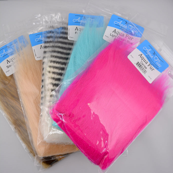 Various colors of Aqua Fur by Aqua Flies arranged in individual bundles—an ultra-fine, translucent synthetic dubbing perfect for steelhead, salmon, and streamer patterns.