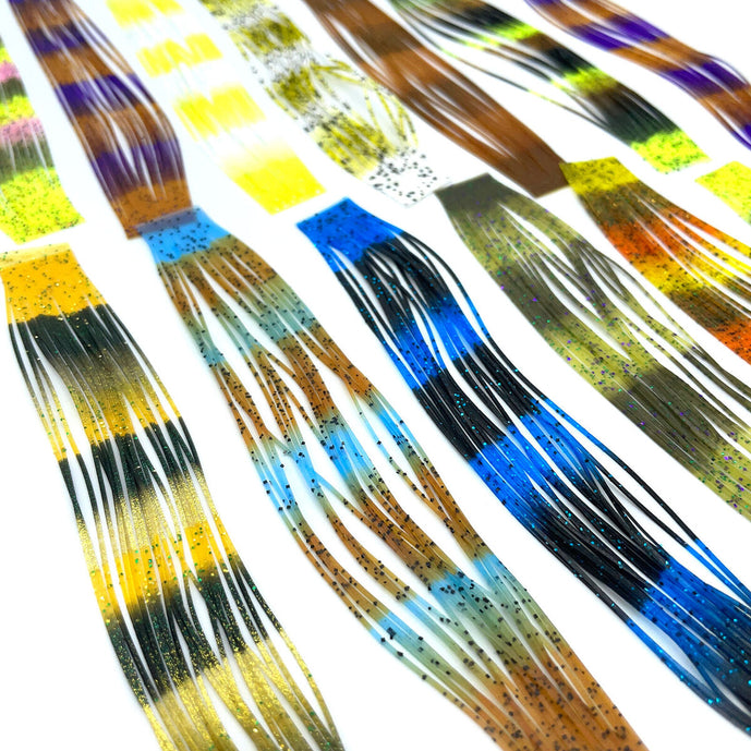 Hareline Fly Enhancer Legs are premium silicone fly tying legs that add irresistible movement, vibrant color, and natural lifelike action to your flies. Perfect for streamers, hoppers, stoneflies, and saltwater patterns, these durable rubber legs are a go-to material for enhancing realism and strike-triggering motion in both freshwater and saltwater flies.