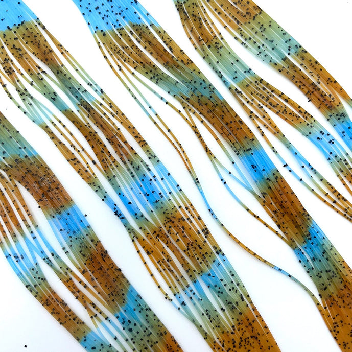 Light Blue Pumpkin Fly Enhancer Legs by Hareline add subtle flash and natural movement to streamers, nymphs, and bass patterns—ideal for imitating leggy aquatic insects and creating lifelike action in the water.