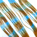 Light Blue Pumpkin Fly Enhancer Legs by Hareline add subtle flash and natural movement to streamers, nymphs, and bass patterns—ideal for imitating leggy aquatic insects and creating lifelike action in the water.