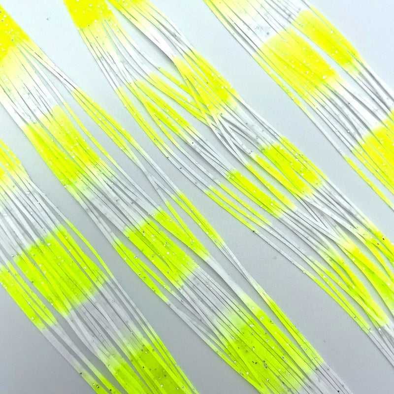 White Chartreuse Fly Enhancer Legs by Hareline offer high-visibility flash and lifelike motion—ideal for saltwater flies, streamers, and poppers targeting trout, bass, and predatory species in low-light or murky conditions.
