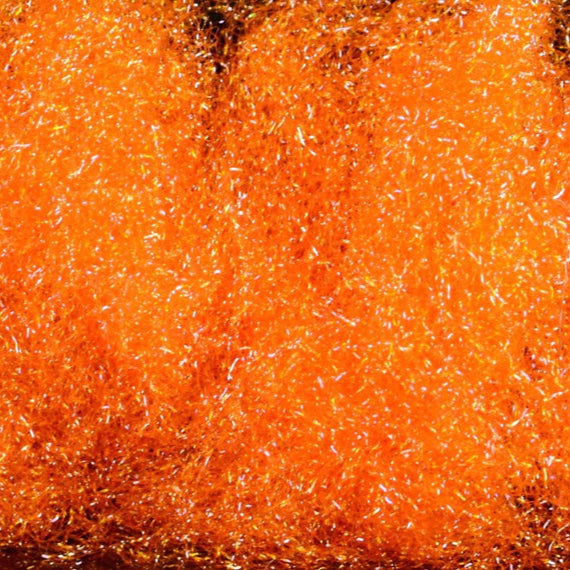 Hareline Ice Dub in UV Hot Orange – reflective synthetic dubbing ideal for adding flash and color to nymphs, emergers, and streamers.
