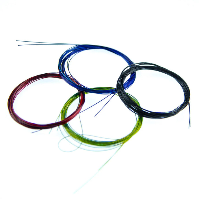 Spools of Senyo’s Trout Wire by Hareline, designed for delicate segmentation and ribbing on trout flies, with vibrant color options and a strong, fine-gauge build perfect for micro patterns.