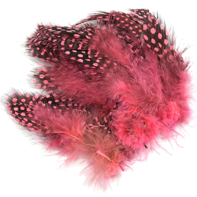 Hareline Strung Guinea Feather in Shrimp Pink – pale, warm-toned feather with signature black speckles, ideal for shrimp imitations, saltwater patterns, and soft accent collars.