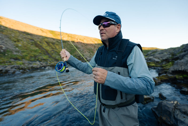 man fishing with vest