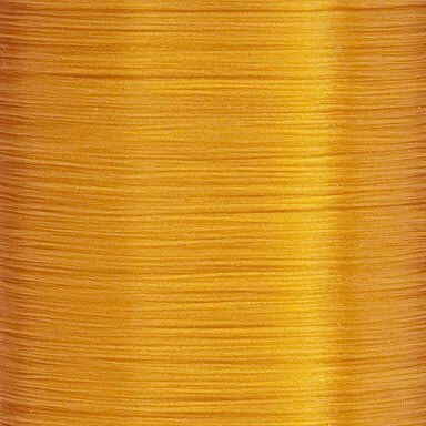 Burnt orange UTC thread spool – bold fly tying thread for attractor patterns and fall color schemes.