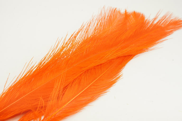 UV2 Raptor Hackle in hot orange – electric orange feathers that add pop to attractor streamers and salmon patterns.