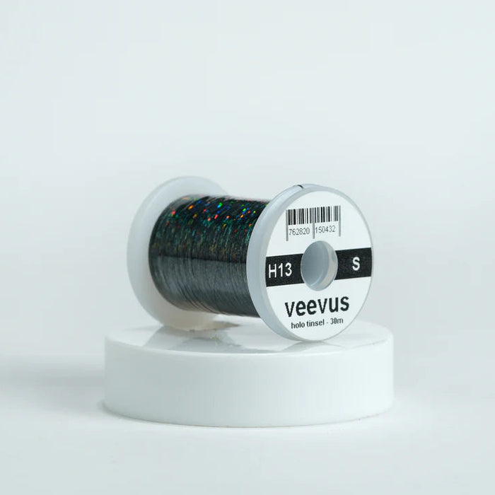 Veevus Holographic Tinsel in Black – bold, reflective fly tying tinsel perfect for creating vibrant bodies, ribbing, and accents on trout, steelhead, and saltwater flies. Available in medium and large sizes.