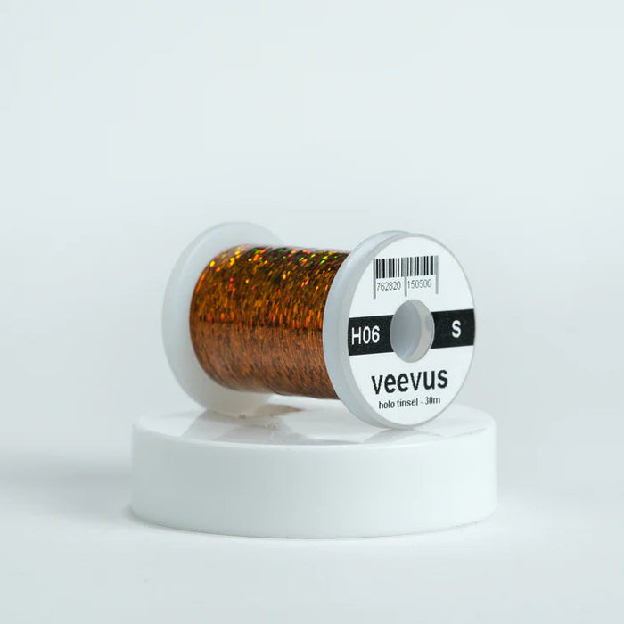 Veevus Holographic Tinsel in Copper – bold, reflective fly tying tinsel perfect for creating vibrant bodies, ribbing, and accents on trout, steelhead, and saltwater flies. Available in medium and large sizes.