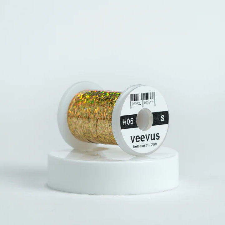 Veevus Holographic Tinsel in Gold – bold, reflective fly tying tinsel perfect for creating vibrant bodies, ribbing, and accents on trout, steelhead, and saltwater flies. Available in medium and large sizes.
