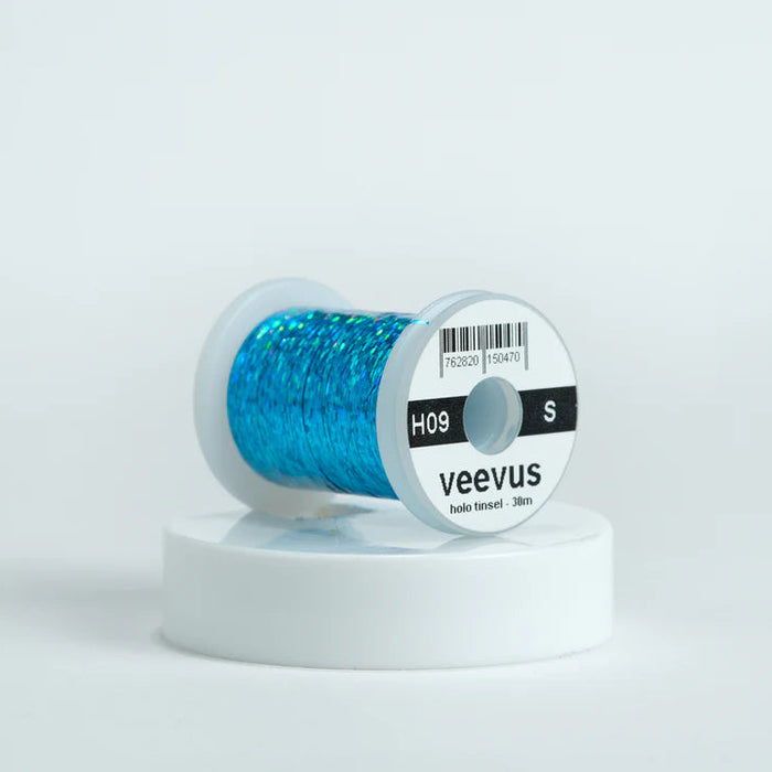 Veevus Holographic Tinsel in Teal – bold, reflective fly tying tinsel perfect for creating vibrant bodies, ribbing, and accents on trout, steelhead, and saltwater flies. Available in medium and large sizes.