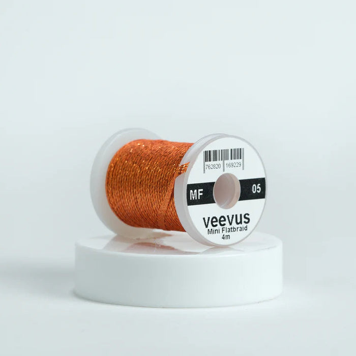 Veevus Mini Flat Braid in Dark Orange – adds a flat, highly reflective shimmer to fly patterns. Perfect for bodies, tags, and ribbing with a modern flash in dark orange.
