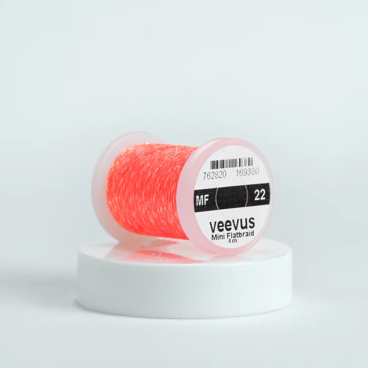 Veevus Mini Flat Braid in Fluorescent Orange – adds a flat, highly reflective shimmer to fly patterns. Perfect for bodies, tags, and ribbing with a modern flash in fluorescent orange.