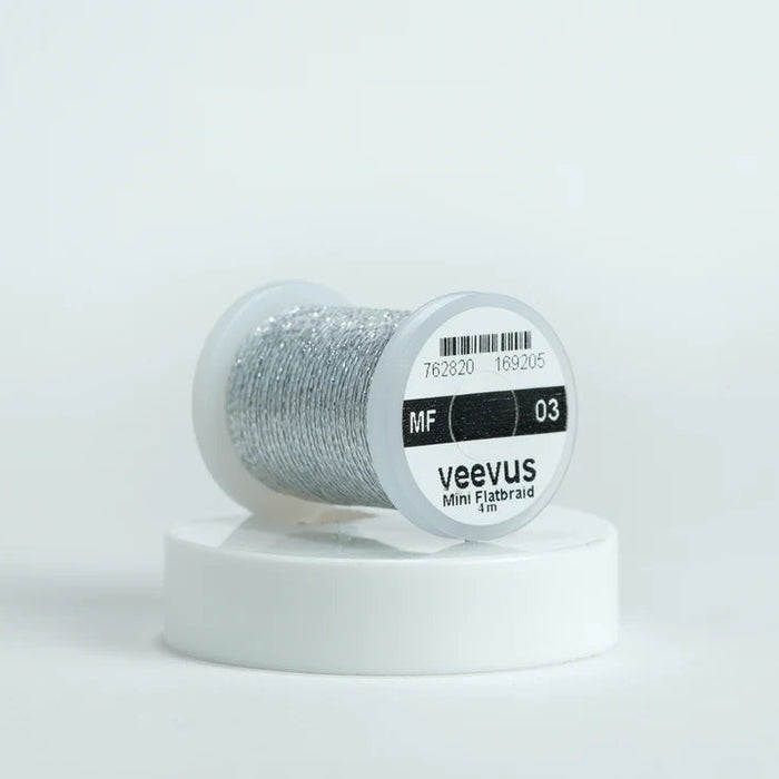 Veevus Mini Flat Braid in Leaded Tin – adds a flat, highly reflective shimmer to fly patterns. Perfect for bodies, tags, and ribbing with a modern flash in leaded tin.