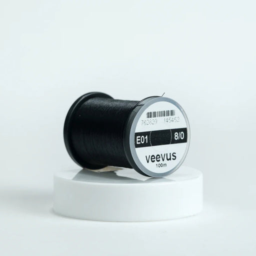 Veevus Thread in Black – ultra-strong, lightweight fly tying thread available in 6/0, 8/0, and 10/0 sizes, perfect for precise, clean wraps on any pattern.