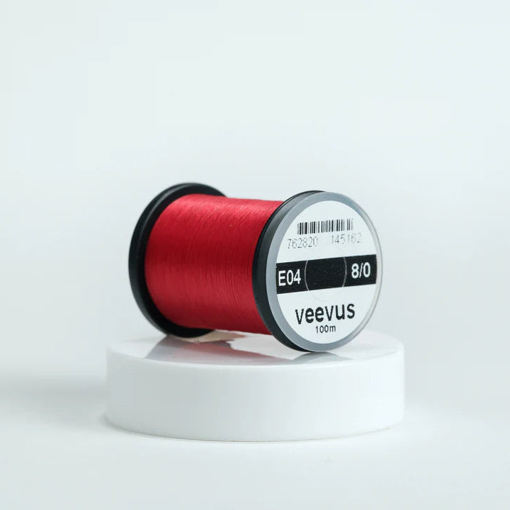 Veevus Thread in Red – ultra-strong, lightweight fly tying thread available in 6/0, 8/0, and 10/0 sizes, perfect for precise, clean wraps on any pattern.