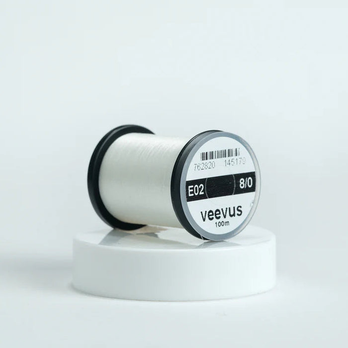 Veevus Thread in White – ultra-strong, lightweight fly tying thread available in 6/0, 8/0, and 10/0 sizes, perfect for precise, clean wraps on any pattern.