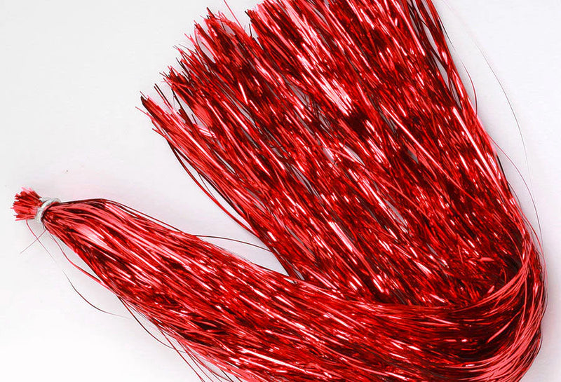 Strands of red flashabou fly tying material, perfect for adding bold flash to streamers, salmon flies, and intruders.
