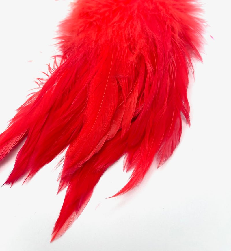 Fluorescent steelhead pink UV Fish Hunter Select Schlappen – UV-charged feathers for steelhead flies, intruders, and swing patterns.