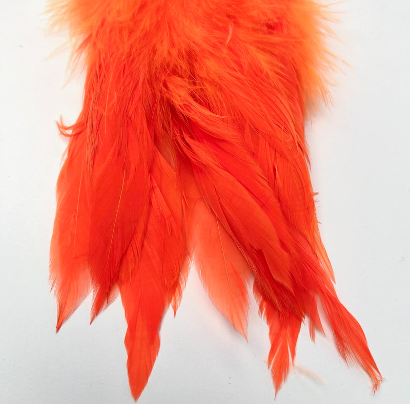 Fluorescent shrimp pink UV Fish Hunter Select Schlappen – soft pink UV-reactive feathers for salmon flies, steelhead intruders, and subtle attractor patterns.