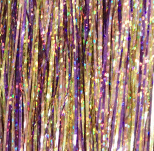 Strands of holographic flashabou in sunset color, featuring iridescent tones ideal for flashy streamers, baitfish patterns, and saltwater flies.