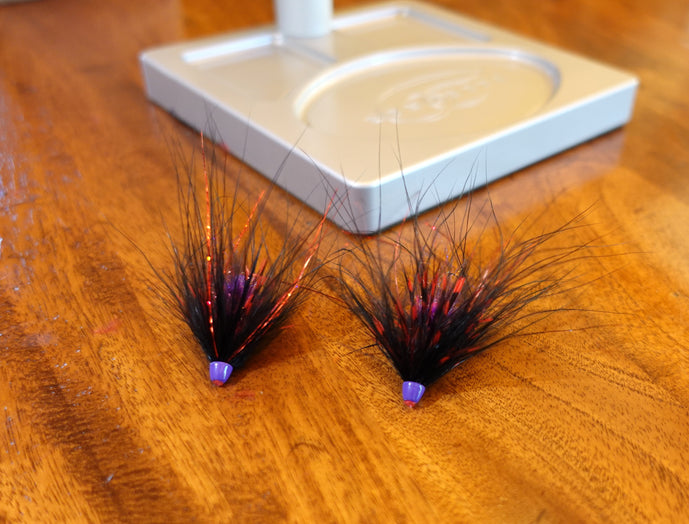 Lavender conehead finishing Hayden’s Pan Handler Hobo Spey tube fly with black schlappen and marabou collar