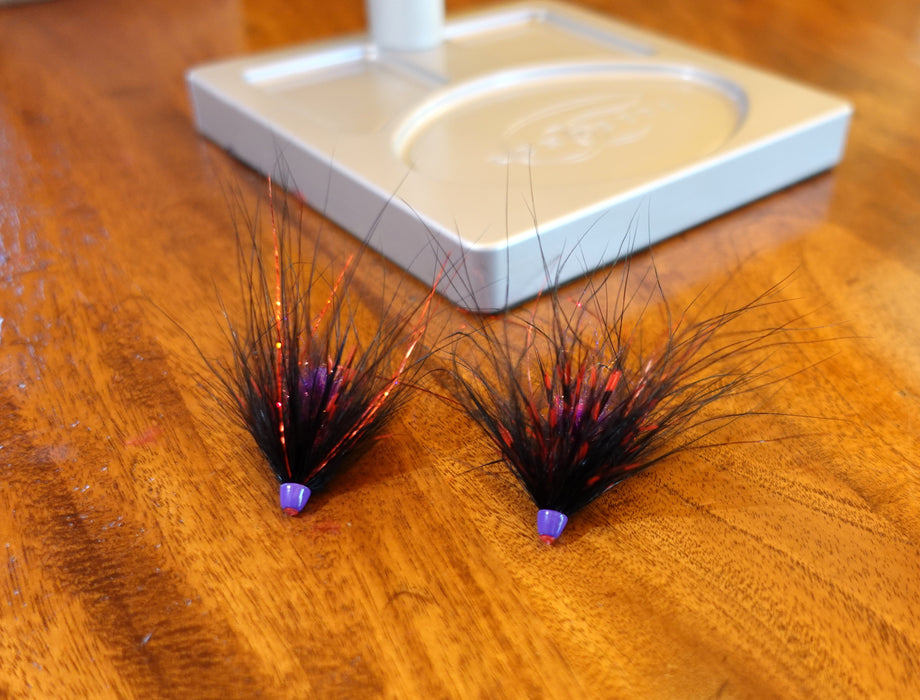 Lavender conehead finishing Hayden’s Pan Handler Hobo Spey tube fly with black schlappen and marabou collar